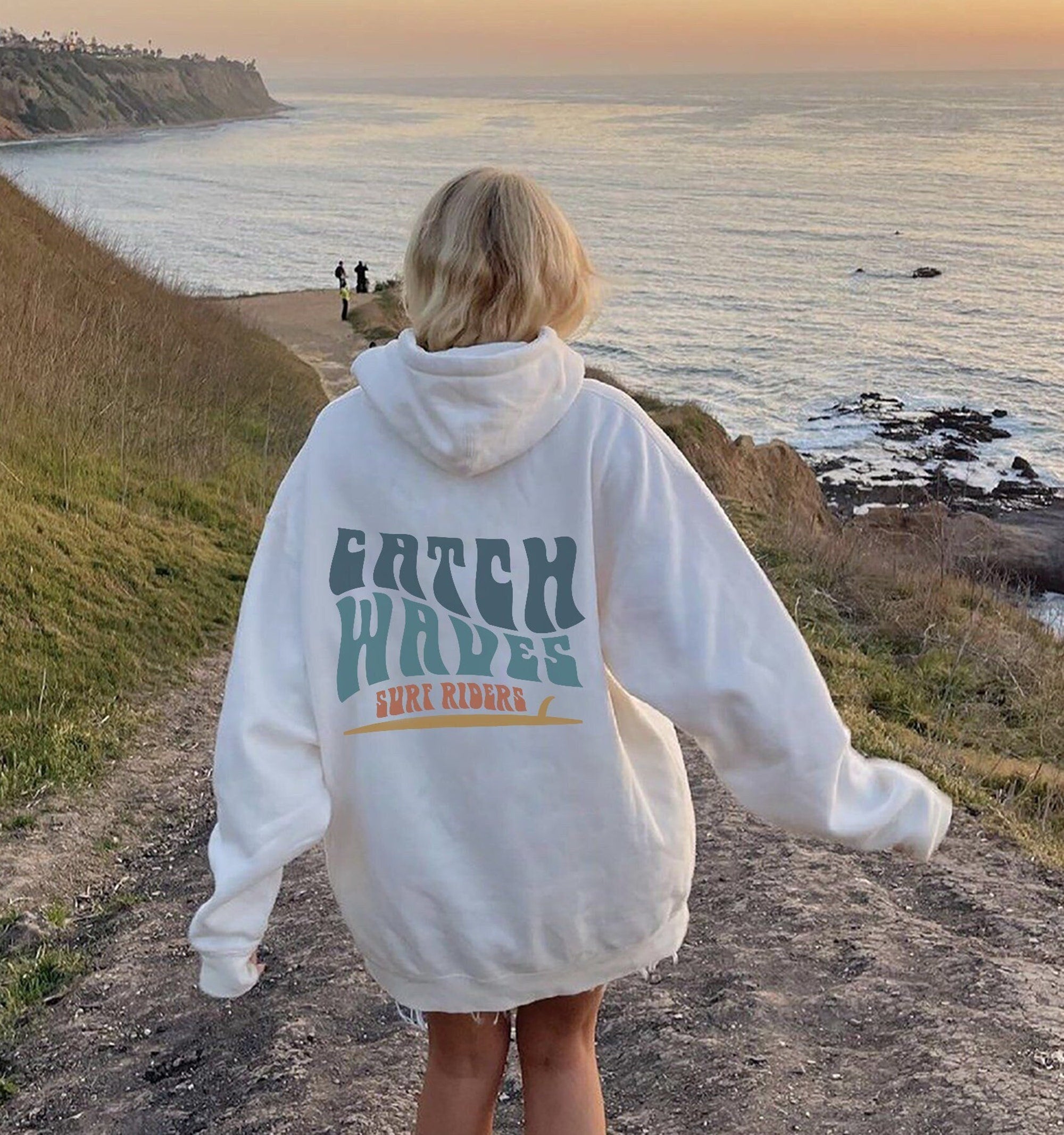 Catch Waves Sunset Surfer Hoodie – Oversized Beach Sweatshirt