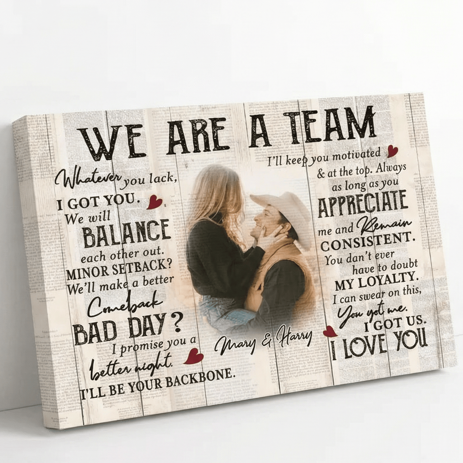 Wooden plaque with romantic message and couple photo on a white surface