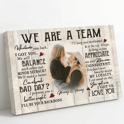 Wooden plaque with romantic message and couple photo on a white surface