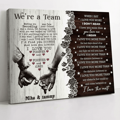 Canvas print with hands holding each other and romantic text on a wooden background.