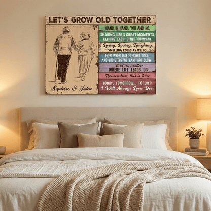 Decorative wall art above a bed with a romantic quote and couple illustration.
