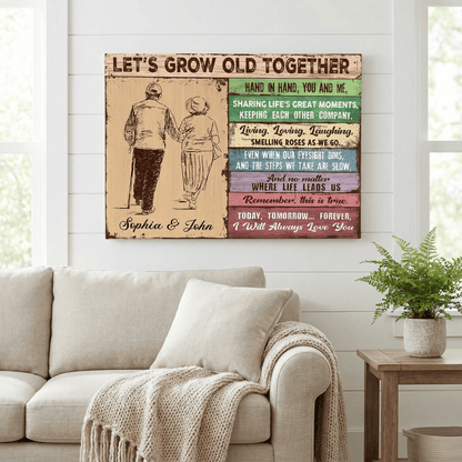 Decorative wall art with text and illustration of a couple holding hands in a living room.
