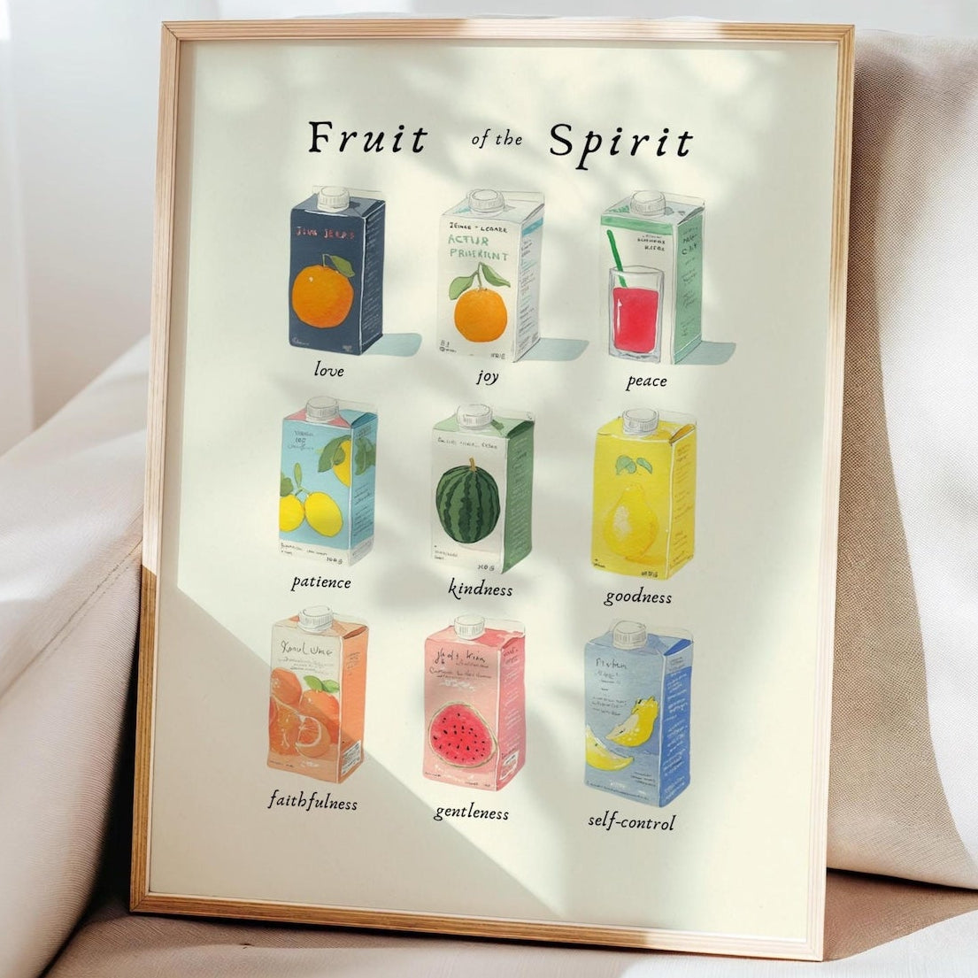 Framed artwork titled 'Fruit of the Spirit' with colorful boxes on a white background