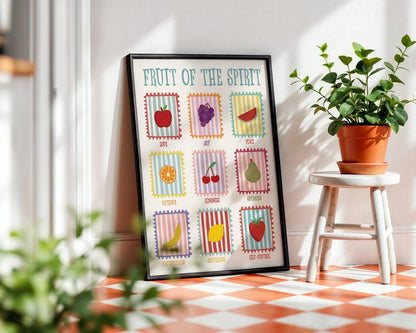 Framed artwork titled 'Frutt of the Spirit' on a checkered floor with plants.