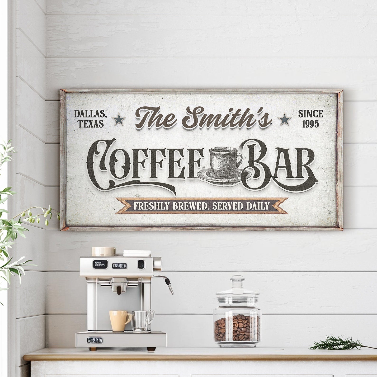 Personalized coffee bar sign with a coffee machine and jar of coffee beans on a wooden shelf.