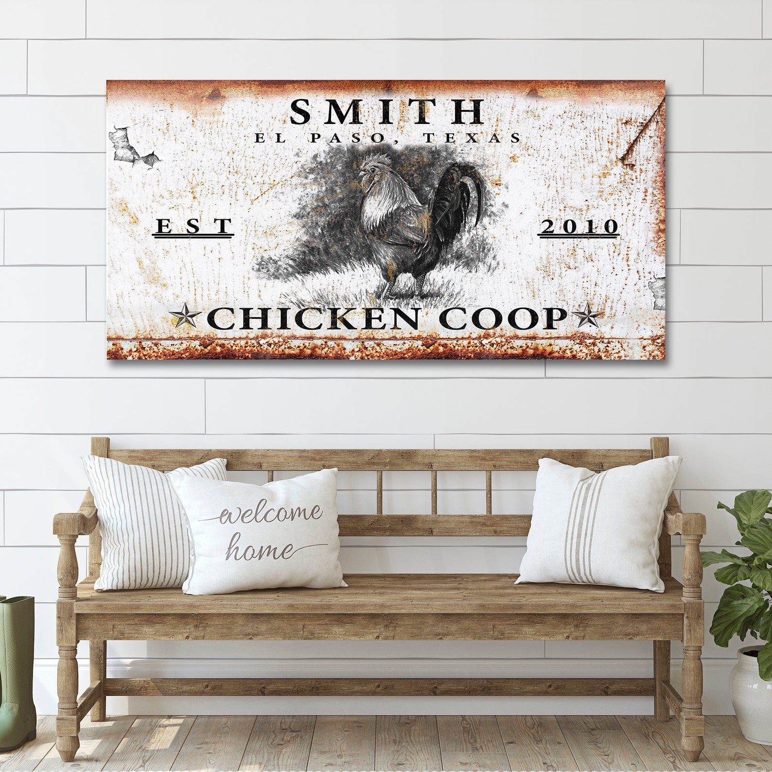 Decorative sign for a chicken coop with rooster illustration on a wooden bench.